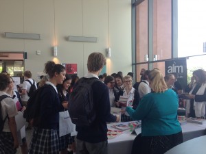 Students talking to tertiary education providers about creative course offerings.